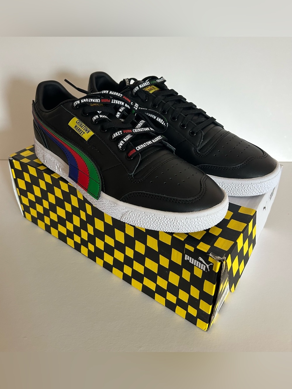 Puma Black Low-Top Sneakers with Red, Blue & Green Formstrip